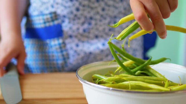 Fresh Green and Yellow Beans in Bowl, Woman Preparing Food in Background