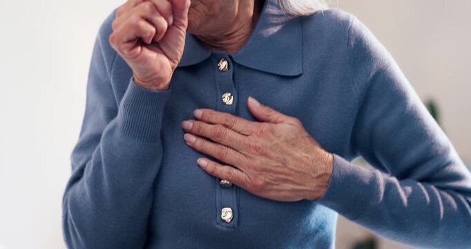Cough, hands and elderly woman on bed in home with allergies, chest infection or sore throat. Illness, retirement and senior female person with tuberculosis, cold or flu symptoms in bedroom of house
