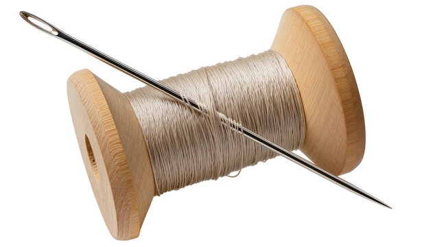 Wooden spool with beige thread and metal needle, isolated on transparent background