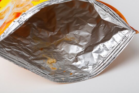 The Crumpled Snack Bag Interior Shrouded in Metallic Foil Shine
