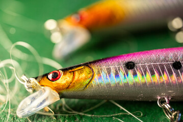 Macro close up of colorful fishing lure with sharp hooks The Concept of predator angling © VicVaz