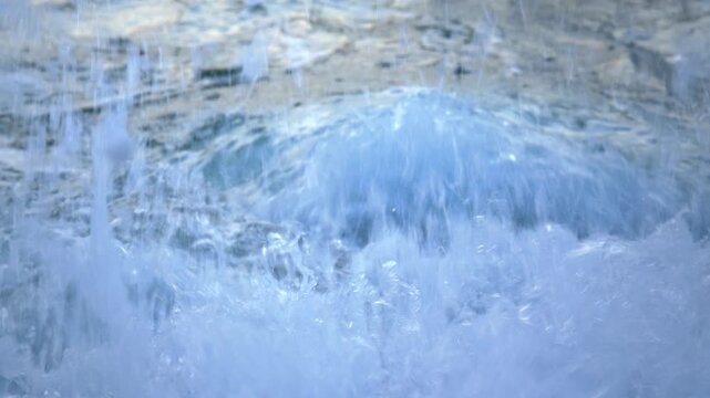 Refreshing Sea Water Splashing Over Green Algae Rocks