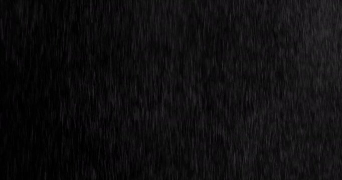 Realistic motion blurred rain streaks falling on a black background creating a natural weather VFX overlay ideal for compositing visual effects digital artwork atmospheric scenes and graphic design pr