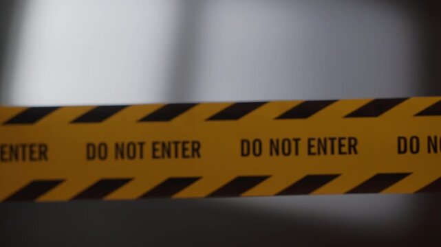 Focus Pulling Out from Sharp Do Not Enter Caution Tape to Blurry Soft Window Shadow at Dark Room Crime Scene at Night, Mysterious Unresolved Mood with Flashing Red Siren Light⁠
