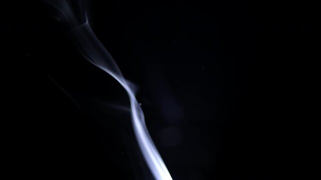 Real smoke and nebular background, abstract white smoke rising on a black background, creating an atmospheric effect. This visual element is overlays, design, and motion graphics, adding a moody and