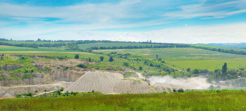 Panoramic Landscape of Active Surface Mineral Quarry, Industrial Mound Site Among Beautiful Rural Nature