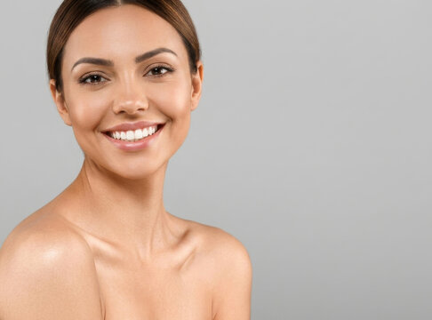 Fresh-faced beauty shot showcasing a woman's natural radiance and perfect smile