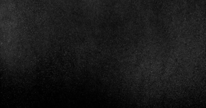 Fine water mist drifting across a black background creating a realistic atmospheric VFX overlay with soft floating droplets perfect for compositing visual effects digital artwork and cinematic environ