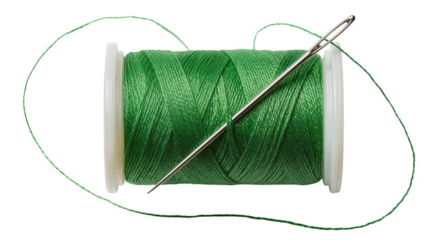 Green thread spool with needle piercing through, isolated on transparent background