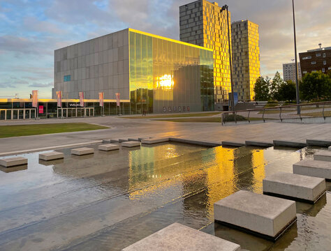 The modern city of Almere in a bright blue cloudy sky, at sunset  Almere, Flevoland, the Netherlands, July, 2026