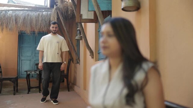 Romantic Couple Standing Outside Traditional Rustic House &ndash; Travel and Lifestyle Concept
