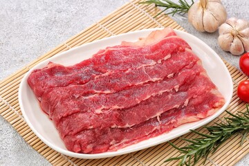 Fototapeta premium Fresh thinly sliced ​​raw beef or Shortplate 