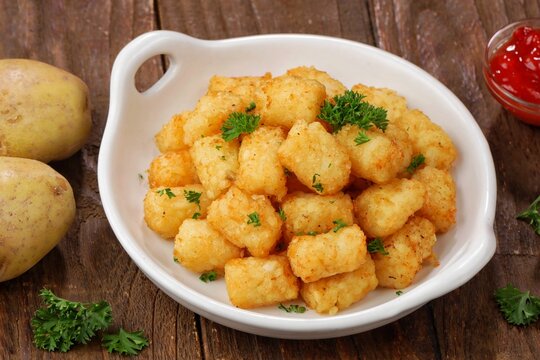 Delicious fried potatoes known as tater tots or pom pom potato
