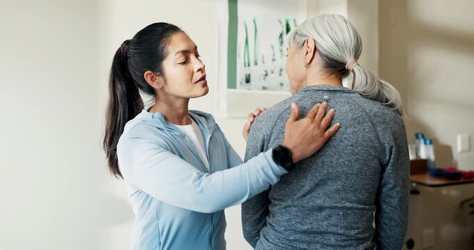 Massage, women and spine injury in physical therapy session for healing, consultation and healthcare. Person, senior patient and back pain with rehabilitation, chiropractic and joint wellness