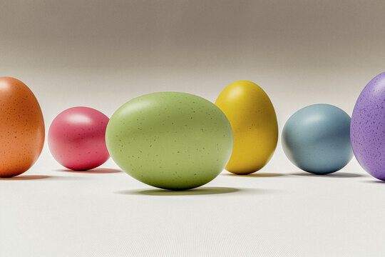 Row of colorful spotted Easter eggs on light background