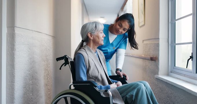 Nurse, woman or senior with window in wheelchair for assisted living, healthcare or mobility in hospital. Caregiver, elderly or female person with a disability for assistance, help or medical aid