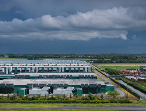 Large data center in Middenmeer under dark rainclouds