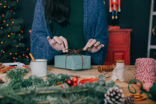 Woman wrapping christmas gifts