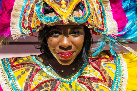 Bahamas, Nassau, Woman posing in a colorful carneval costum