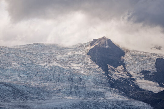 Soft light illuminates the ancient ice of a glacier in Iceland