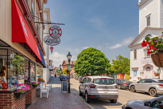 Newburyport, MA, US-June 23, 2025: Street scene in historic downtown of this small town with its quaint streets with 19th century brick buildings and trendy shops and restaurants.