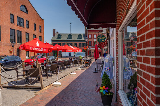 Newburyport, MA, US-June 23, 2025: Street scene in historic downtown of this small town with its quaint streets with 19th century brick buildings and trendy shops and restaurants.