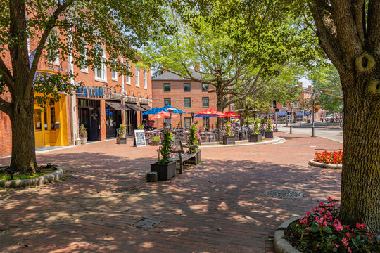 Newburyport, MA, US-June 23, 2025: Street scene in historic downtown of this small town with its quaint streets with 19th century brick buildings and trendy shops and restaurants.