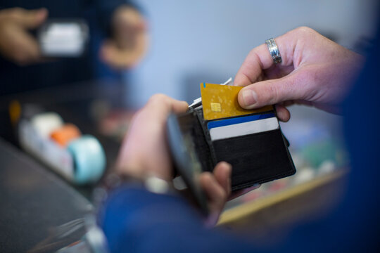 Man holding wallet with cards