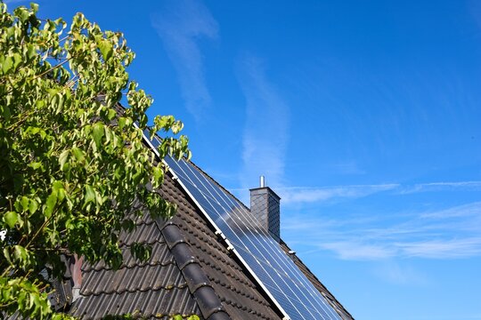 Solar panels on house roof generating clean energy