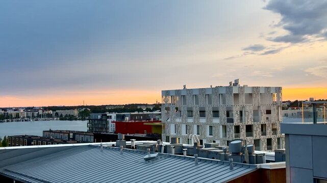 Panning View over Jatkasaari Rooftops at Dusk in Helsinki
