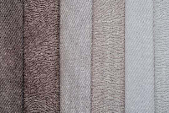Collection of fabric swatches showing different textures and neutral colors
