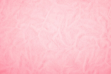 Fototapeta premium Pink leather texture close up with subtle sheen