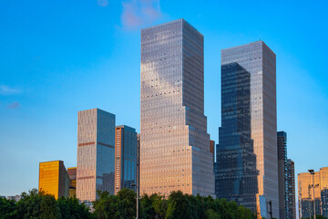 Fototapeta premium modern office building exterior in downtown district in Chengdu under dusk light