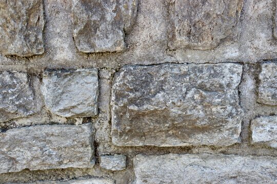A close view of the old stone wall surface.