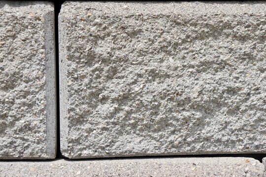 A close view of the white brick wall.