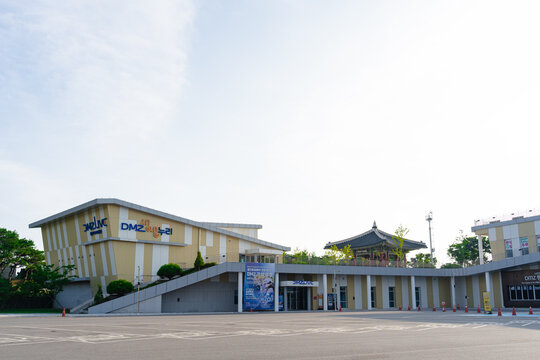 July 12, 2026, Paju, South Korea - Exterior view of the DMZ Live and Pyeonghwa Nuri complex with a traditional pavilion