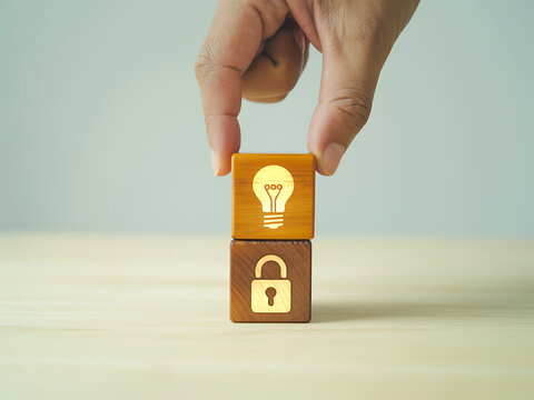 Hand stacking wood blocks with icons