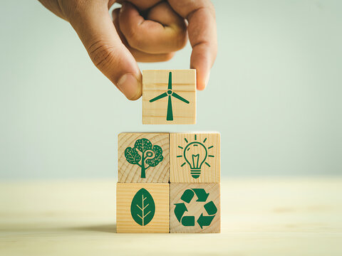 Hand stacking wooden blocks for ecology