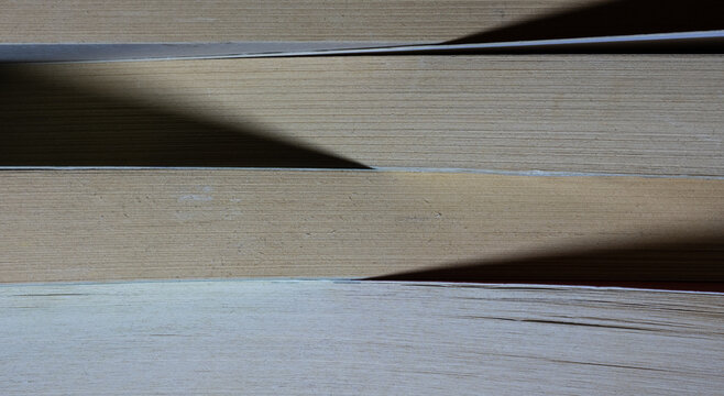 Stack of old books showing pages and texture