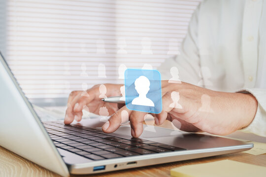 Business professional selecting customer profile on laptop, virtual user interface, digital audience targeting, customer relationship management CRM, human resources recruitment, data driven marketing