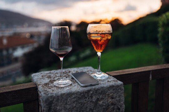 Champagne Glasses and Smartphone on a Terrace During an Elegant Evening Party
