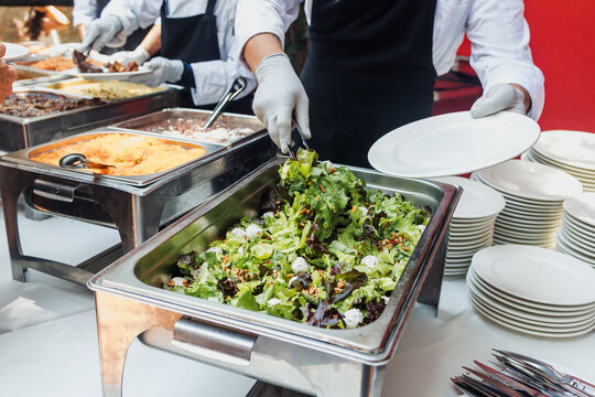 Catering staff serving salad food at a event buffet in Mexico Latin America