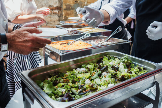 Catering staff serving salad food at a event buffet in Mexico Latin America