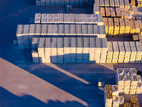 Aerial view of stacks of concrete masonry blocks in a loading area for construction materials in Bluffdale, Utah, United States.