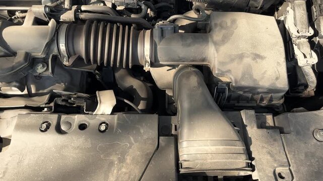 Automotive engine air intake system with air filter housing and intake duct, vehicle maintenance, mechanical engineering and transportation technology.