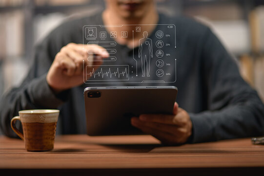 Person Analyzing Digital Health Data Using Futuristic Tech Interface on Tablet