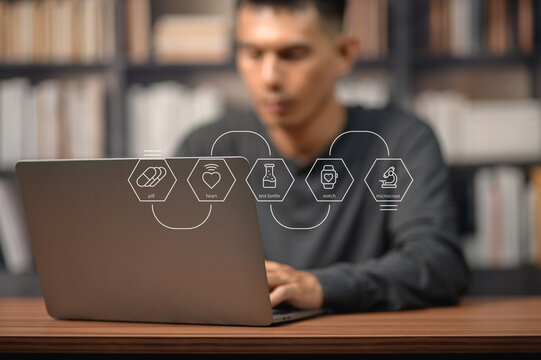 Modern scientist analyzing health data on computer with futuristic icons in background