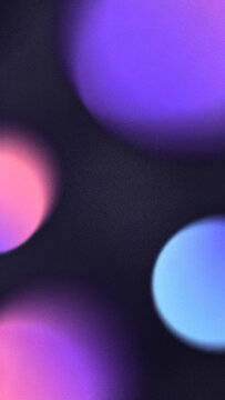Abstract purple pink blurred aura floating spheres background with grainy holographic gradient waves vertical composition perfect for mobile device luxury wallpapers.