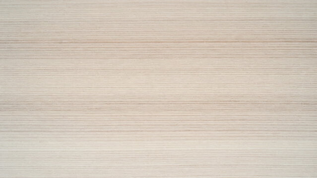 Close-up view of stacked paper edges, horizontal beige and white pages of a thick book or notepad