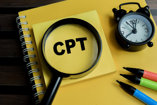 Concept of CPT - Client Processing Time write on sticky notes isolated on Wooden Table.